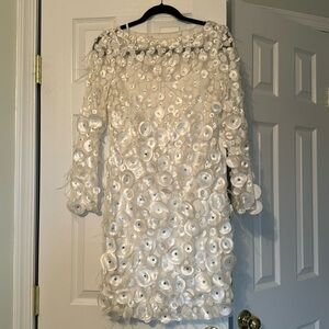 White evening dress with feathers and rhinestone’s
